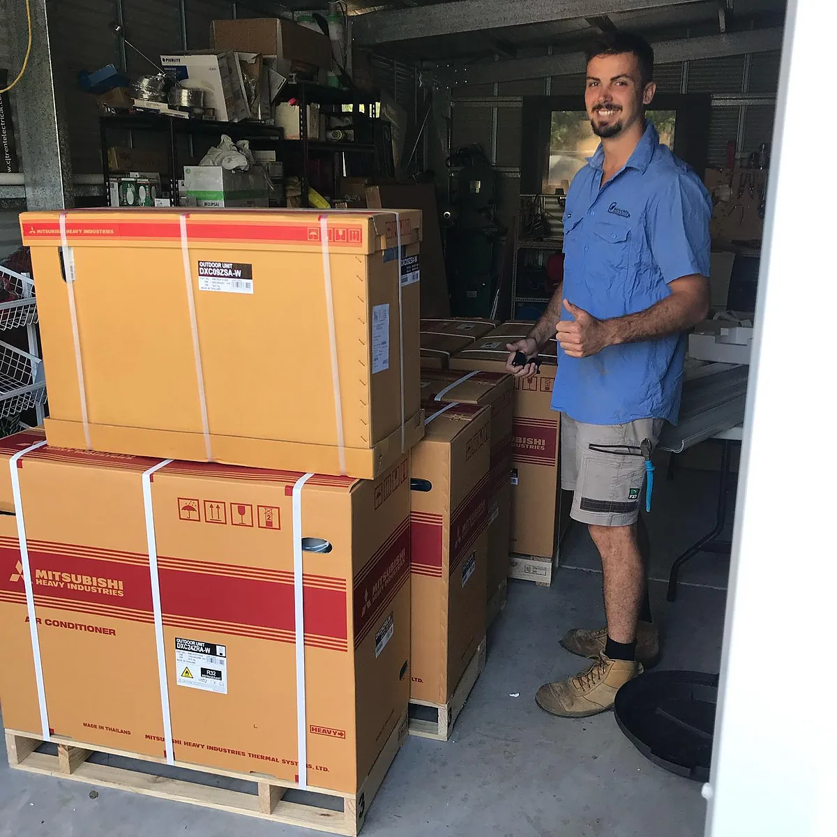 Stacked split system air conditioner boxes in the Watts & Volts shed